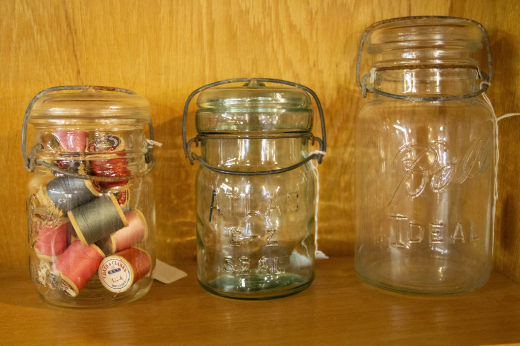 Old jars are a common type of vintage farmhouse decor and can be useful for sorting and storing small items. 