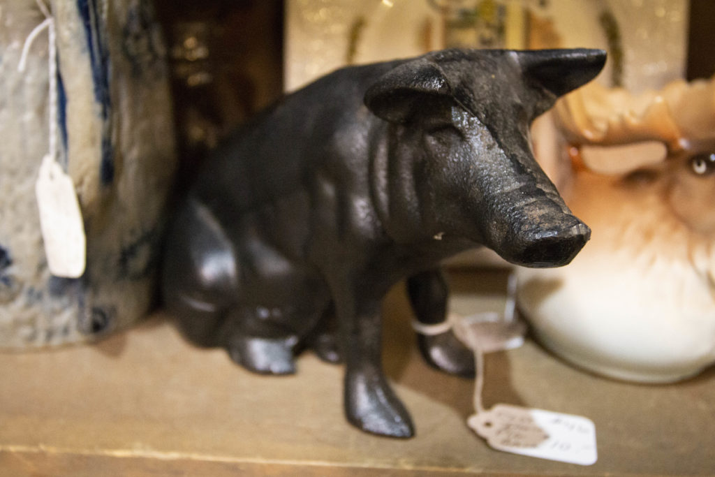 Old cast iron piggy banks and toys are nice small antiques to place in areas where you don't have much room. This particular piggy bank was found at Antique Marketplace & Cafe in Bangor, Maine, with a price tag of just $10.