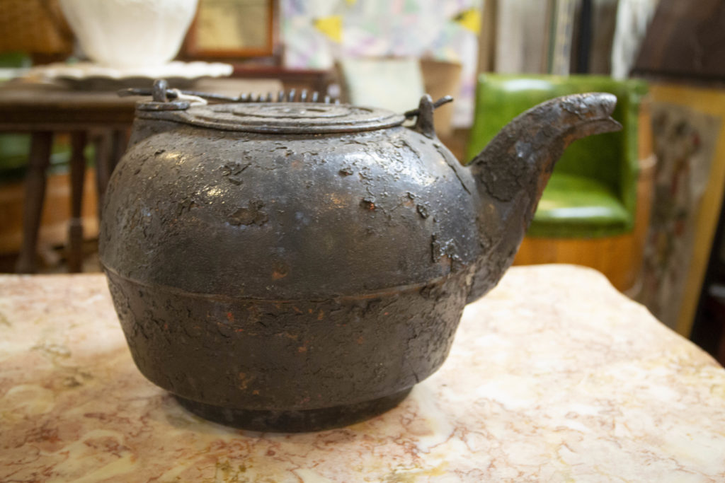 This old cast iron kettle, found at Antique Marketplace & Cafe in Bangor, Maine, makes for a very interesting piece of vintage decor. 