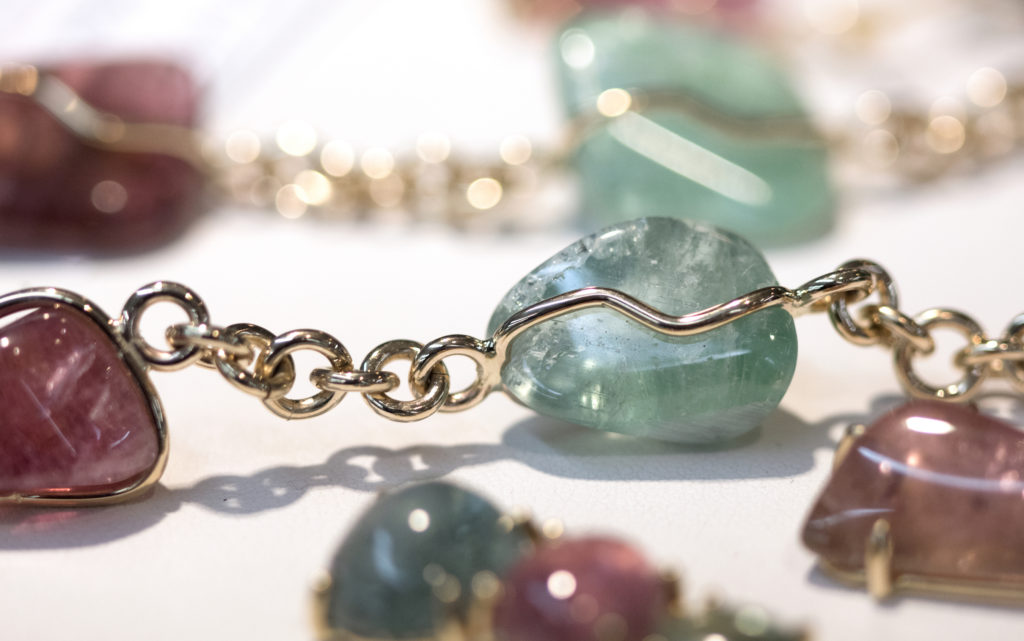 Tourmaline and gold jewelry are seen at Willis' Rock Shop in Bar Harbor, Maine.